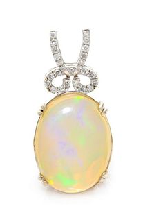 A 14 Karat White Gold, Opal and Diamond Pendant, 3.70 dwts.