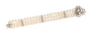 A 14 Karat White Gold, Diamond and Cultured Pearl Multistrand Bracelet, 27.20 dwts.