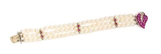 A 14 Karat White Gold, Ruby and Diamond Multistrand Cultured Pearl Bracelet, 19.20 dwts.