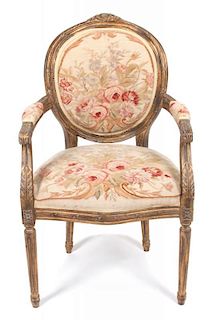 A Louis XVI Style Giltwood Armchair Height 38 inches.
