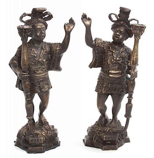A Pair of Bronze Figural Candlesticks