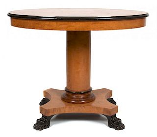 A Biedermeier Parcel Ebonized Oval Occasional Table