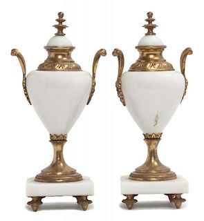 * A Pair of Composite and Gilt Metal Urns  Height 9 3/4 inches.