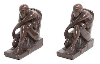 A Pair of Bronze Bookends Height 7 1/4 inches.