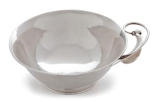 An American Silver Dish, Karl F. Leinonen, Boston, MA, of circular form with stylized handle.