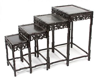 A Set of Four Asian Hardwood Nesting Tables Height of tallest 28 inches.