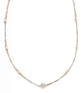 A 14 Karat White Gold, Diamond and Cultured Seed Pearl Necklace, 2.70 dwts.