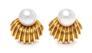 A Pair of 18 Karat Yellow Gold and South Sea Cultured Pearl Earclips, 23.80 dwts.