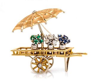 An 18 Karat Bicolor Gold, Diamond, Sapphire and Emerald Flower Cart Brooch, Italian, 10.80 dwts.