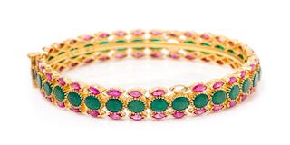 A 22 Karat Yellow Gold, Emerald and Pink Sapphire Bangle Bracelet, 18.60 dwts.