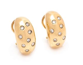 A Pair of 14 Karat Yellow Gold and Diamond Earclips, 8.30 dwts.