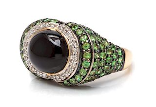 A 14 Karat Gold, Diamond, Onyx and Green Garnet Ring, 6.30 dwts.