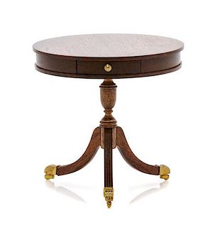 A Regency Style Mahogany Drum Table, Height 2 1/2 x diameter 2 3/4 inches.