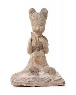 A Pottery Figure of a Female Musician