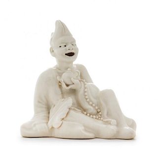 A White Glazed Porcelain Figure of an Immortal Height 4 inches.