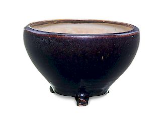 A Black Glazed Stoneware Tripod Censer