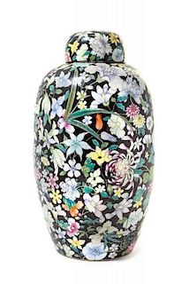 A Black Ground Famille Rose 'Millefleur' Porcelain Covered Jar