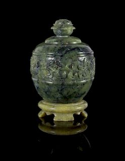 A Carved Spinach Jade Covered Jar