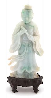 A Carved Apple Green and Jadeite Figure of an Immortal