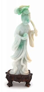 A Carved Apple Green and Celadon Jadeite Figure of Guanyin