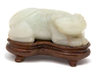 A Carved White Jade Figure of a Mythical Beast