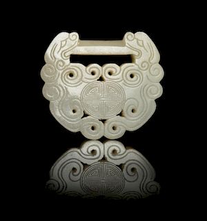 A Carved Pale Celadon Jade Lock-Form Pendant
