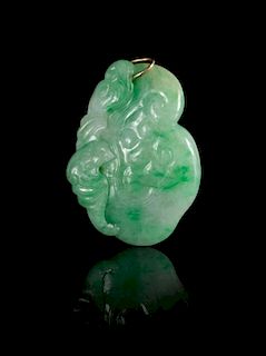 A Carved Apple Green and Celadon Jadeite Pendant
