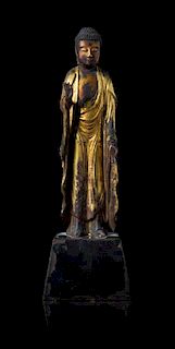 A Gilt Lacquered Wood Figure of Standing Buddha