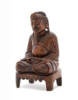 A Carved Wood Figure of Seated Vimalakirti