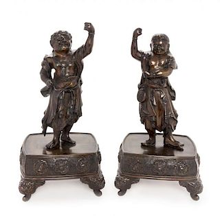 A Pair of Bronze Guardian-Form Candle Holders