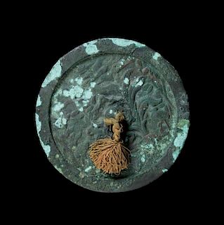 An Archaistic Bronze Mirror Diameter 7 3/4 inches.