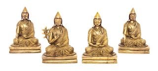 A Set of Four Sino-Tibetan Gilt Bronze Figures of Gelugpa Lamas