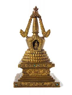 A Tibetan Hardstone Inset Gilt Bronze Stupa