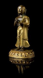 A Sino-Tibetan Gilt Bronze Figure of a Standing Buddhist Monk