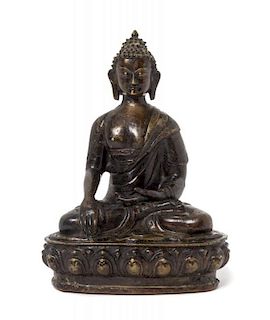 A Sino-Tibetan Parcel-Gilt Bronze Figure of Buddha