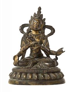A Sino-Tibetan Parcel-Gilt Bronze Figure of Four-Armed Avalokiteshvara