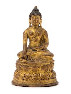 A Gilt Bronze Figure of Buddha Height 4 1/4 inches.