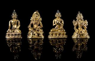 Four Small Sino-Tibetan Gilt Bronze Figures Height of each 1 5/8 inches.