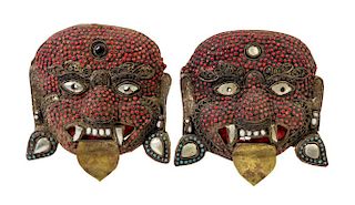 A Pair of Tibetan Coral and Turquoise Inset Brass Masks