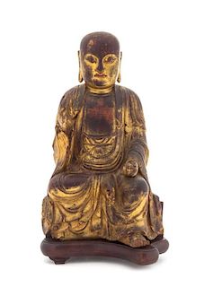 A Gilt Lacquered Wood Figure of Buddha