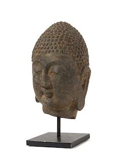 A Carved Grey Stone Head of Buddha