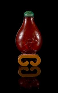 A Carved Amber Snuff Bottle