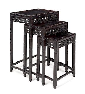 A Set of Three Rosewood Nesting Tables Height of largest 28 x width 19 1/2 x depth 14 inches.