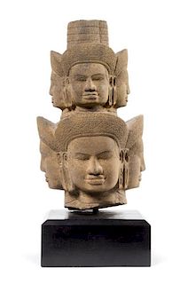A Khmer Sandstone Head of Brahma 17 inches x 12 1/2 inches.