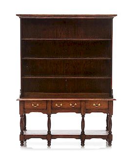 A Welsh Cupboard, Height 7 1/4 x width 5 1/2 x depth 1 3/4 inches.