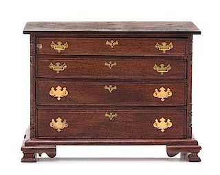 A Chippendale Style Chest of Drawers, Height 2 7/8 x width 4 x depth 1 3/4 inches.