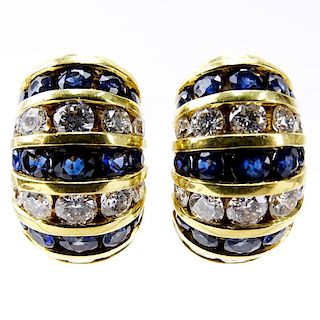 Approx. 4.04 Carat Channel Set Sapphire, 3.24 carat Channel Set Round Brilliant Cut Diamond and 18 Karat Yellow Gold Earrings