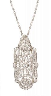 An Art Deco Platinum and Diamond Floral Motif Pendant/Brooch, 7.20 dwts.