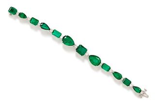 An 18 Karat White Gold, Emerald and Diamond Line Bracelet, 14.80 dwts.