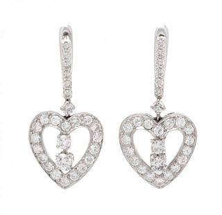 A Pair of White Gold and Diamond Heart Motif Dangle Earrings, 4.10 dwts.